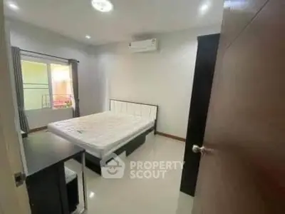 Modern bedroom with sleek design and air conditioning unit