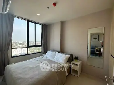 Modern bedroom with large window offering stunning city view