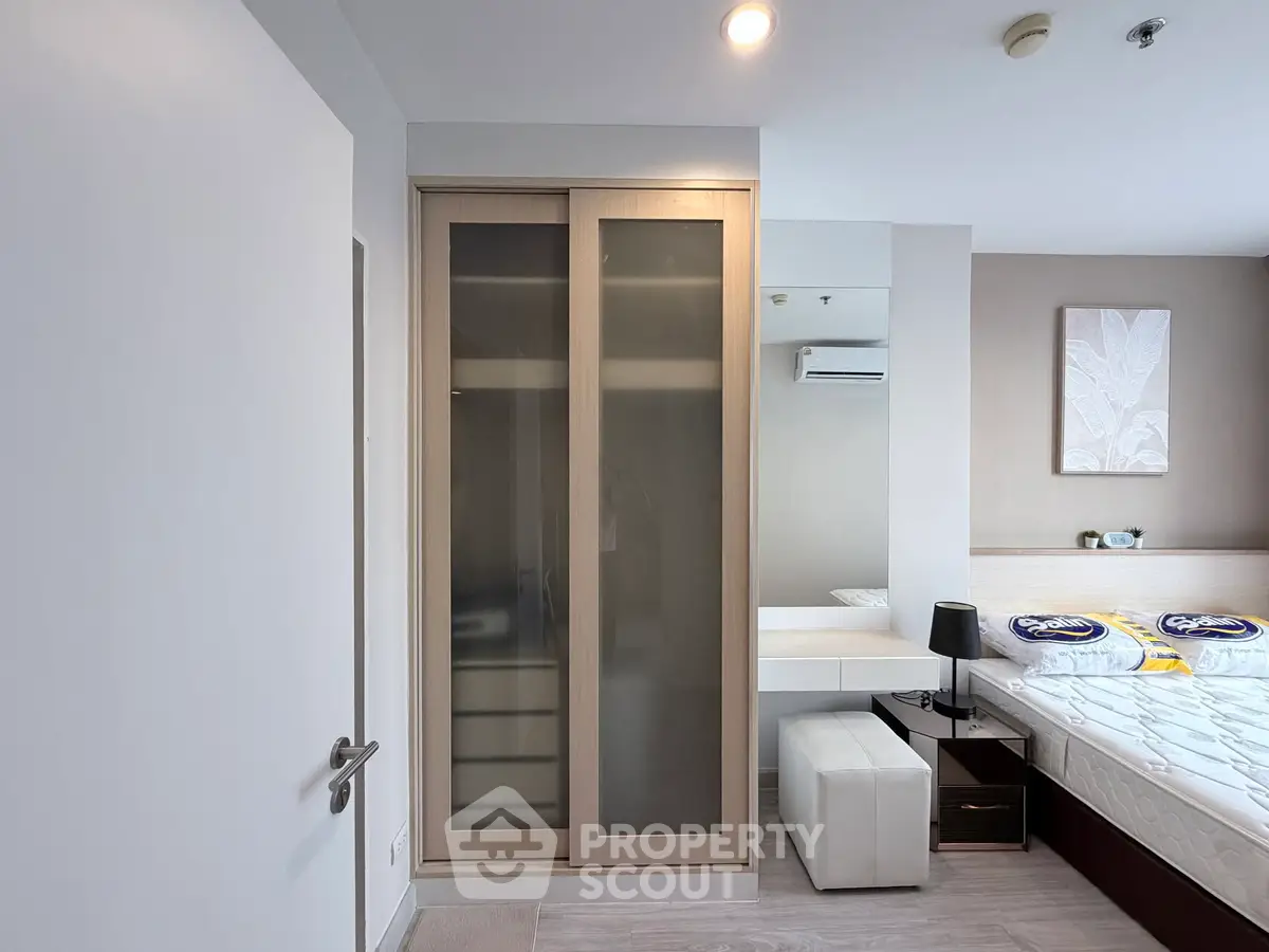 Modern bedroom with sleek wardrobe and stylish decor