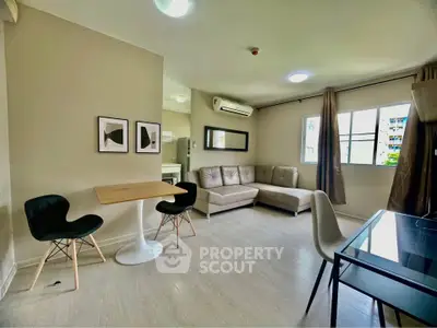 Modern living room with stylish furniture and natural light, perfect for urban living.