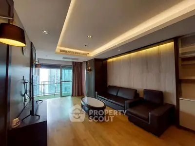 Spacious modern living room with balcony and city view, featuring sleek furniture and ambient lighting.