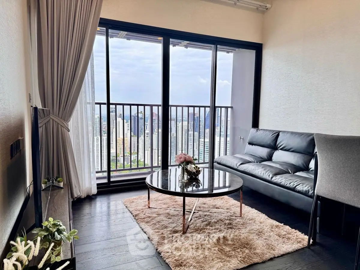 Modern living room with stunning city view from high-rise balcony, sleek furniture and elegant decor.
