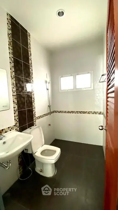 Modern bathroom with sleek design and stylish tile accents