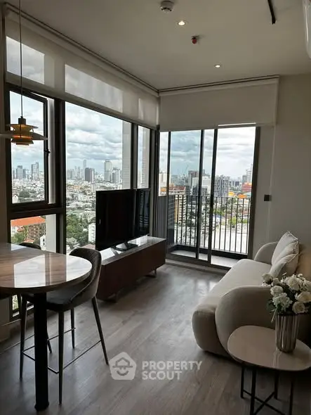 Modern living room with city view and balcony access
