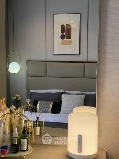 Stylish bedroom with modern decor and elegant lighting, perfect for a cozy retreat.