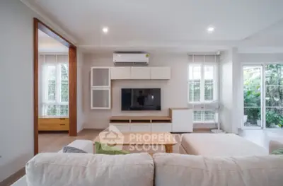 Spacious modern living room with natural light and stylish decor