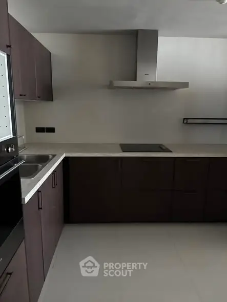 Modern kitchen with sleek cabinetry and built-in appliances