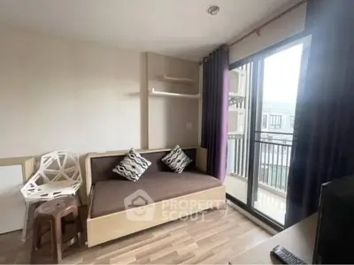 Cozy living room with modern decor and balcony access in urban apartment