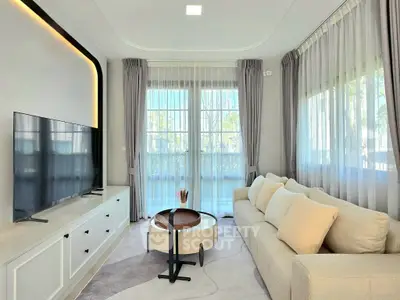 Elegant living room with large windows and modern decor