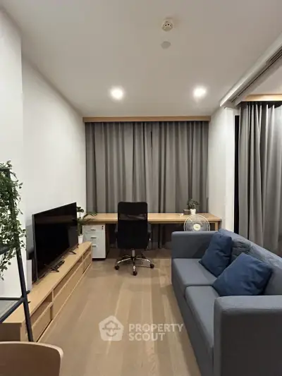 Modern living room with sleek furniture and natural light, perfect for urban living.