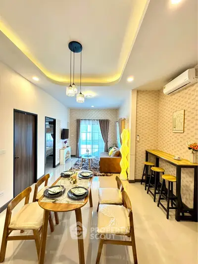 Modern open-concept living and dining area with stylish decor and ample natural light.