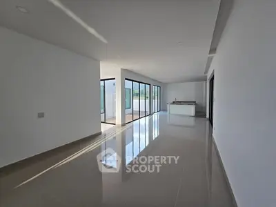 Spacious modern living room with large windows and open layout