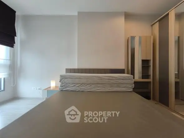 Spacious bedroom with modern design and ample natural light