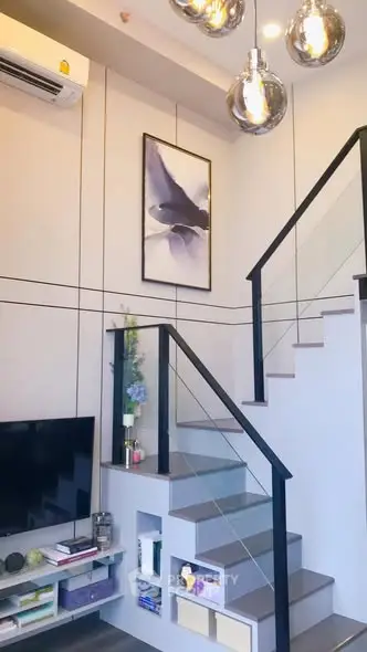 Modern duplex living room with stylish staircase and contemporary decor