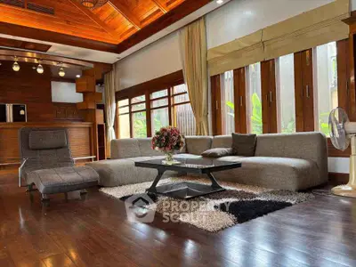 Luxurious living room with modern furniture and wooden ceiling design