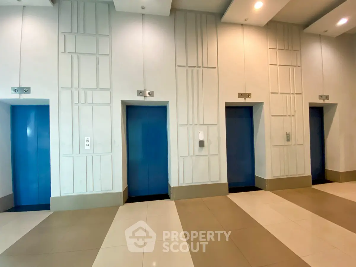 Modern building elevator lobby with sleek design and multiple elevators