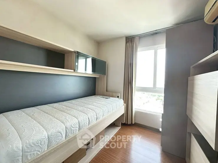 Modern bedroom with sleek design and ample natural light