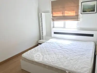 Bright and cozy bedroom with modern furnishings and natural light.