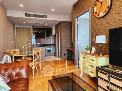 Chic living room with vintage decor and open kitchen layout in modern apartment