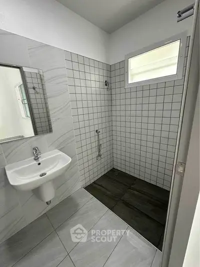 Modern bathroom with sleek tiles and minimalist design