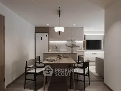 Modern open-layout kitchen and dining area with sleek design and elegant lighting.