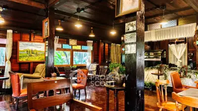 Charming rustic living room with wooden decor and vintage furniture, perfect for cozy gatherings.