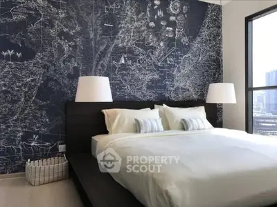 Modern bedroom with stylish map-themed accent wall and large windows offering city views.