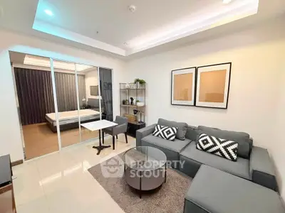 Modern living room with stylish decor and cozy seating in a contemporary apartment.