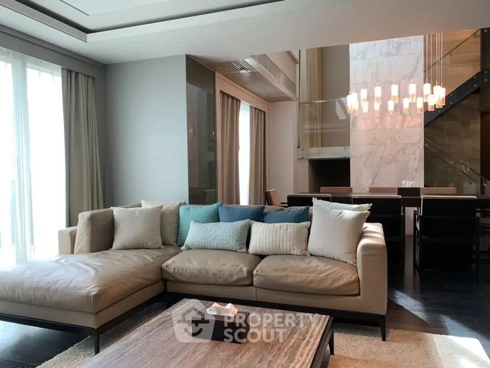 Luxurious modern living room with elegant sectional sofa and chic dining area, perfect for stylish urban living.