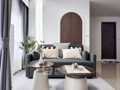 Stylish modern living room with elegant decor and cozy seating area.