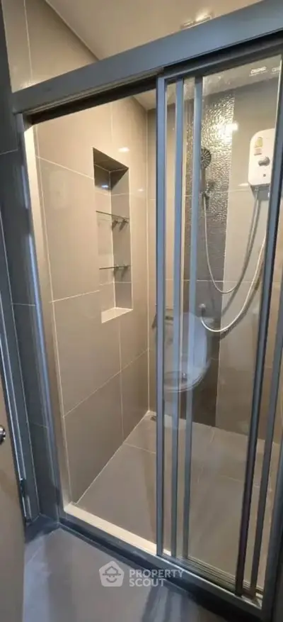 Modern bathroom with sleek shower enclosure and contemporary fixtures
