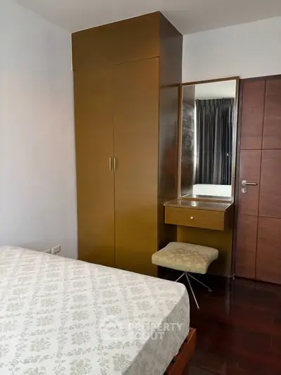Cozy bedroom with built-in wardrobe and stylish dressing table