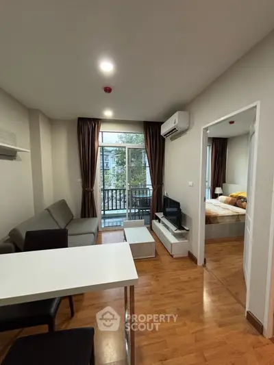 Modern apartment living room with balcony and bedroom view