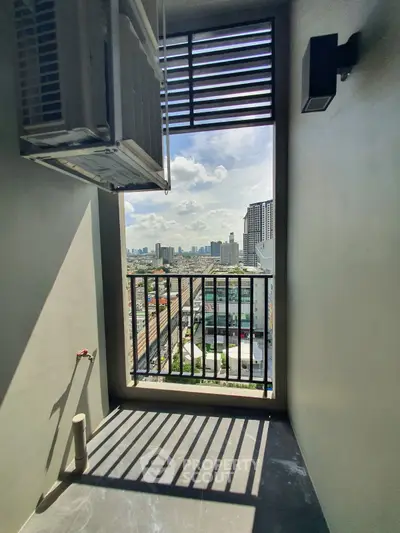 Stunning city view from a modern balcony with sleek design and ample sunlight.