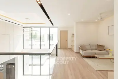 Spacious modern living room with natural light and elegant decor
