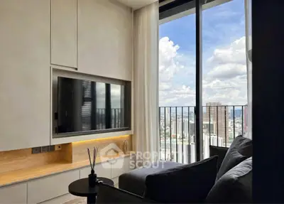 Modern living room with large window offering stunning city view, sleek furniture, and built-in TV unit.