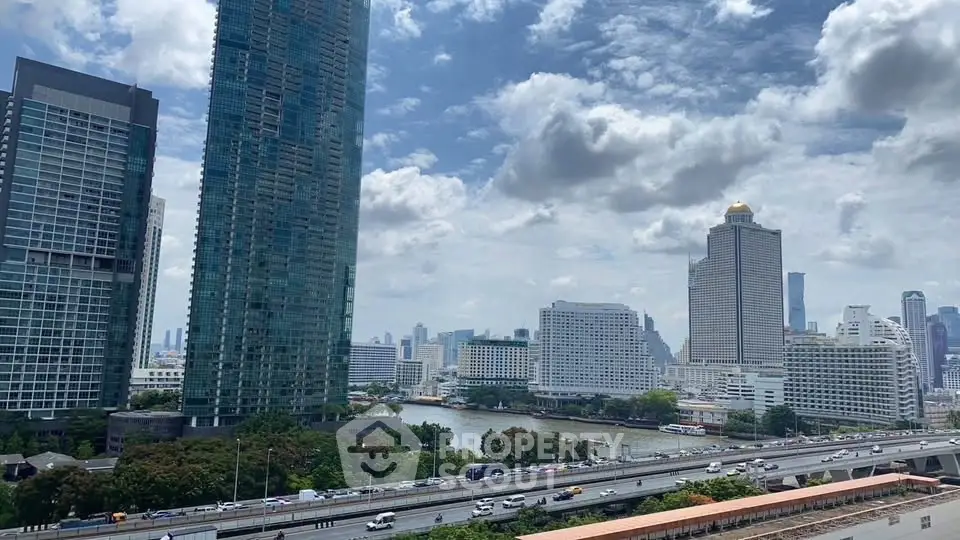 Stunning cityscape view with modern high-rise buildings and river in vibrant urban setting.