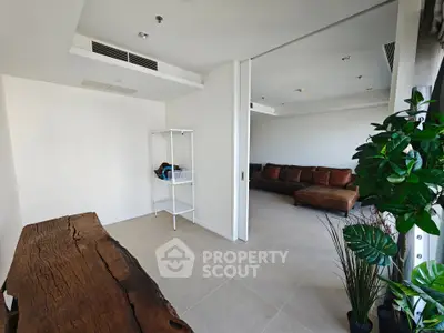 Spacious modern living room with natural light and stylish decor