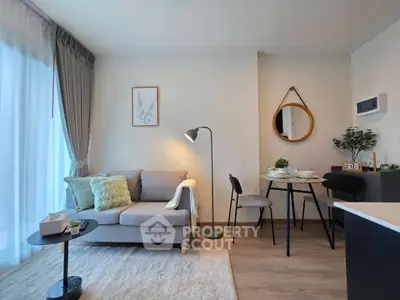 Modern living room with cozy sofa and dining area in stylish apartment