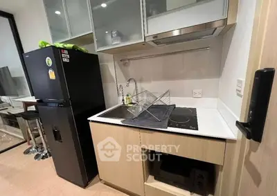 Compact modern kitchen with sleek appliances and efficient layout