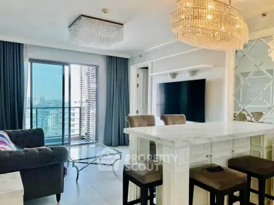Luxurious living room with elegant chandelier and city view, featuring modern furniture and stylish decor.