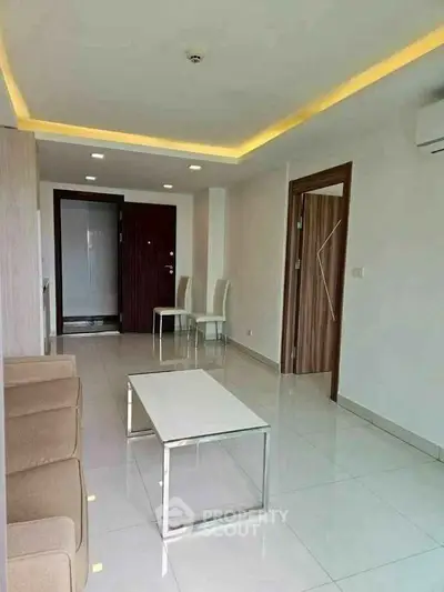 Modern living room with sleek furniture and ambient lighting