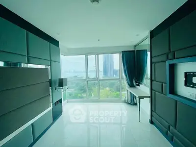 Spacious modern living room with panoramic city view and sleek design
