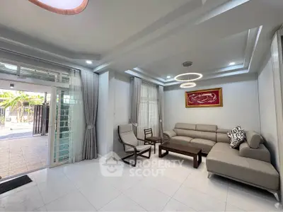 Spacious modern living room with elegant furniture and natural light