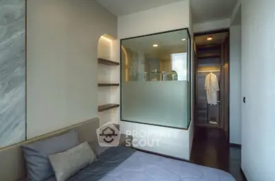 Modern bedroom with glass partition and walk-in closet