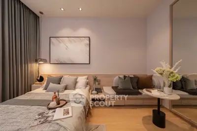 Modern bedroom with elegant decor and cozy seating area