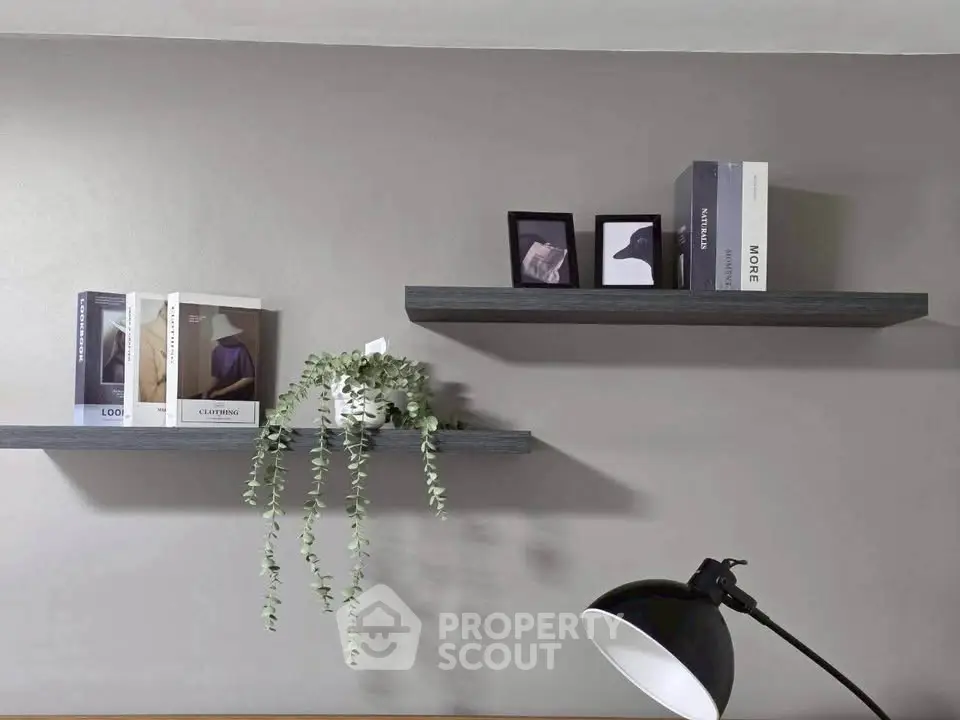 Modern minimalist interior with floating shelves and stylish decor accents.