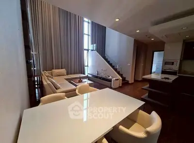 Luxurious modern living room with high ceilings and elegant decor