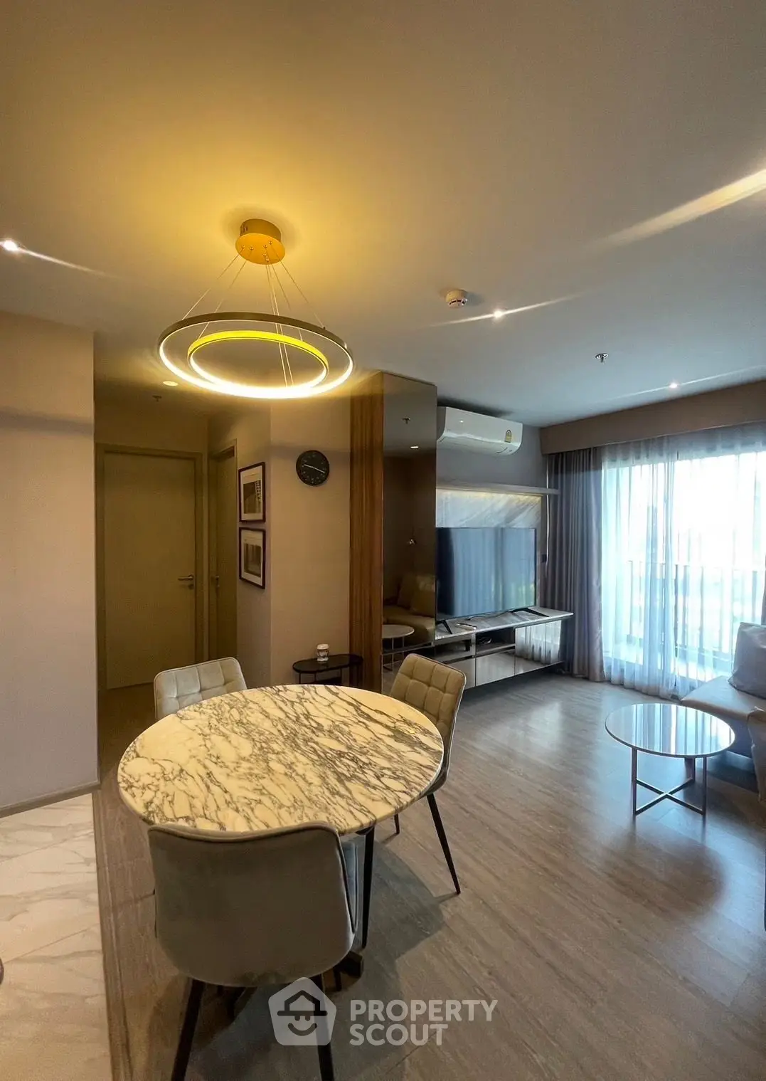 Modern living room with elegant marble dining table and stylish lighting