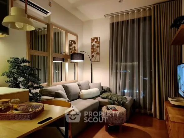 Cozy modern living room with stylish decor and ambient lighting, perfect for relaxation and entertainment.